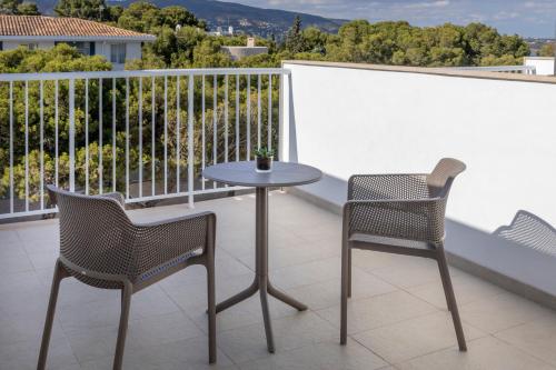 a table and two chairs on a balcony at Hotel Florida Magaluf - Adults Only in Magaluf