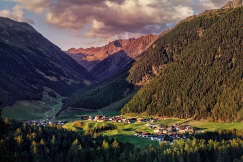 a village in a valley in the mountains at Ferienhaus Knor in Umhausen