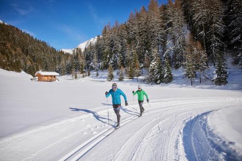 two people cross country skiing in the snow at Ferienhaus Knor in Umhausen