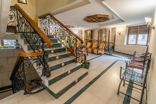 a staircase in a living room with a lobby at Hotel Santo Domingo de Silos in Santo Domingo de Silos