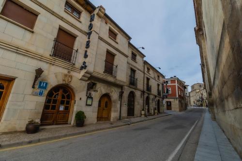 an empty street in an alley with buildings at Hotel Santo Domingo de Silos in Santo Domingo de Silos