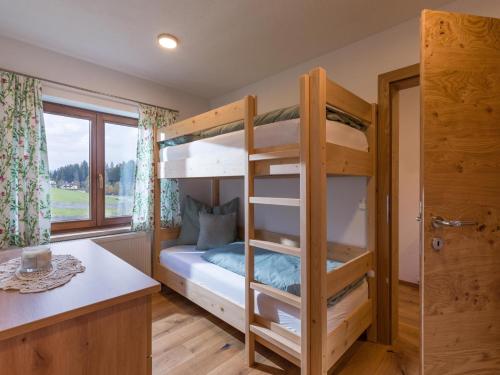 a bedroom with bunk beds in a house at Ferienhaus Widmann in Kirchberg in Tirol
