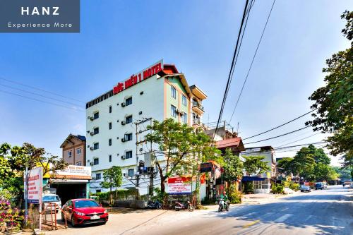 a building on the side of a city street at S79 Duc Hieu Airport Hotel in Hanoi