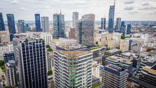 an aerial view of a city with tall buildings at Royal Tulip Warsaw Centre in Warsaw