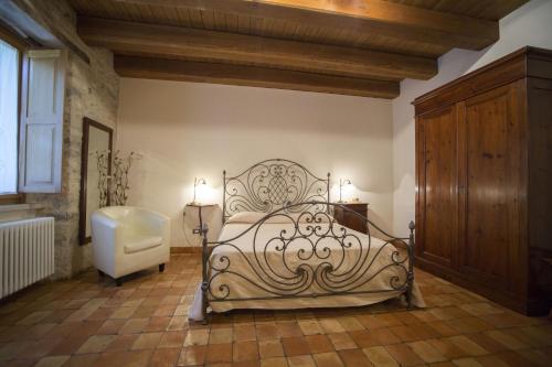 Ένα ή περισσότερα κρεβάτια σε δωμάτιο στο Albergo Diffuso La Piana dei Mulini