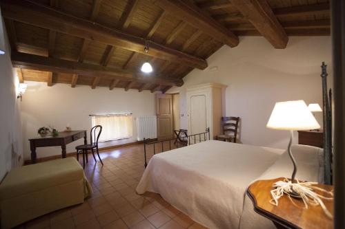 Ένα ή περισσότερα κρεβάτια σε δωμάτιο στο Albergo Diffuso La Piana dei Mulini