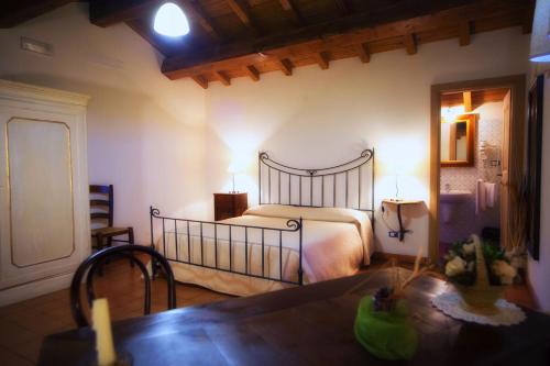 Ένα ή περισσότερα κρεβάτια σε δωμάτιο στο Albergo Diffuso La Piana dei Mulini