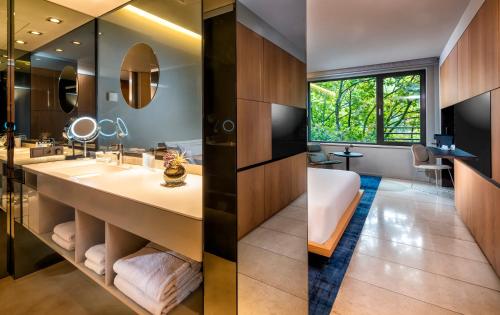 a bathroom with a sink and a mirror at SANA Berlin Hotel in Berlin