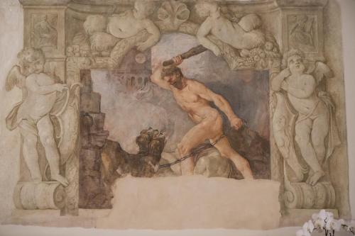 a painting of a painting of a man playing baseball at Grand Hotel Majestic gia' Baglioni in Bologna