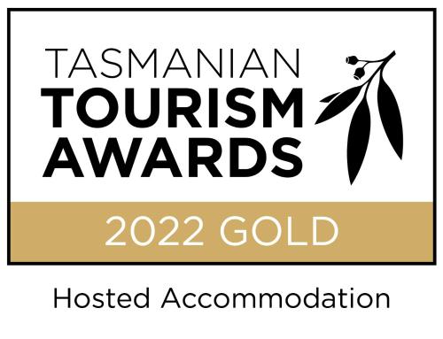 a sign that reads tasmanian tourism awards and aisted associationotent organisation at Oceana B&B in Howrah
