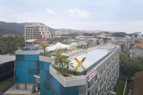 a building with a x on the top of it at JonoX Phuket Karon Hotel in Karon Beach
