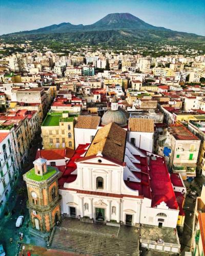 an aerial view of a city with a church at RaRoom Boutique in Torre del Greco