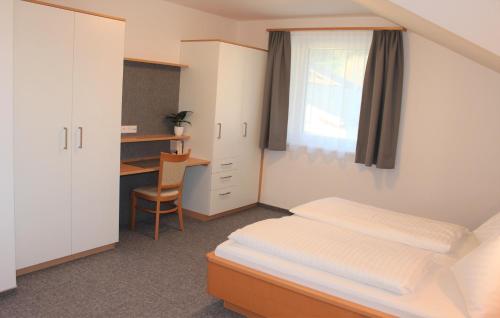 Ein Bett oder Betten in einem Zimmer der Unterkunft Ferienhaus Birkenweg