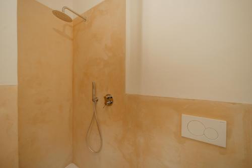 a shower with a shower head in a bathroom at Villa Elicriso Charme e Nature - Goelba in Portoferraio