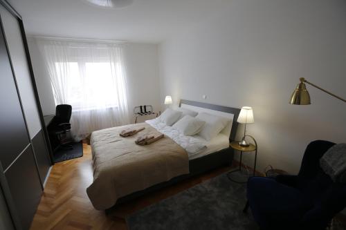 Postel nebo postele na pokoji v ubytování Apartment K&T Čakovec