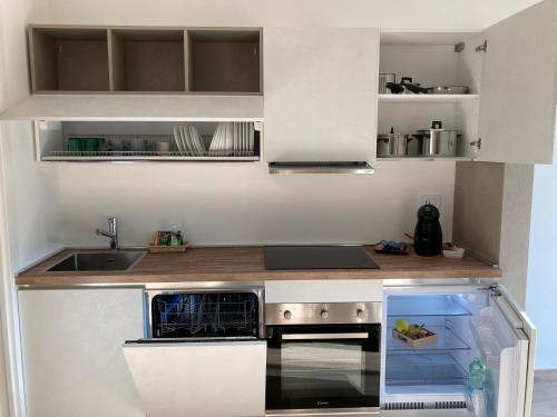 A kitchen or kitchenette at Suite du Parc & Hotel