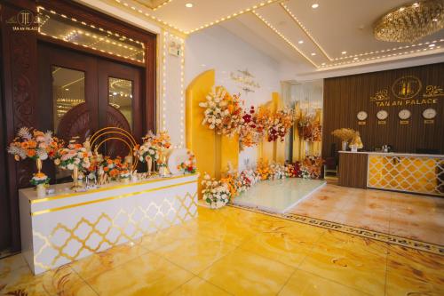 a lobby with a flower display in a store at Tan An Palace in Hai Phong