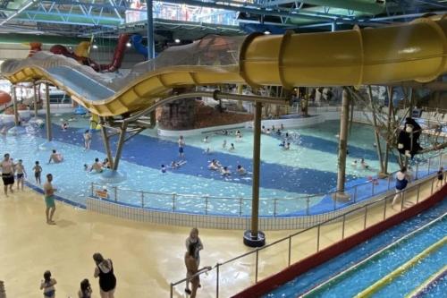 a group of people in a pool at a water park at SPACIOUS DETACHED 5 Bedroom4 Bathroom WIFI Parking in Newcastle under Lyme