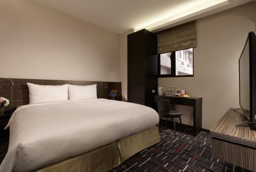 Tempat tidur dalam kamar di Capital Hotel SongShan