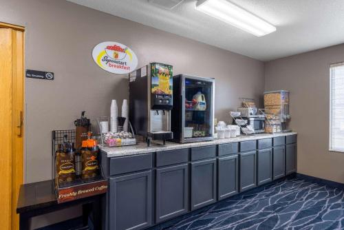 a coffee shop with a counter with a drink dispenser at Super 8 by Wyndham Jackson MN in Jackson