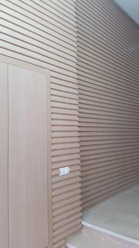 a wooden wall with a toilet in a room at A 200m de la Plage, du Haut Standing au coeur du Parc in Mohammedia