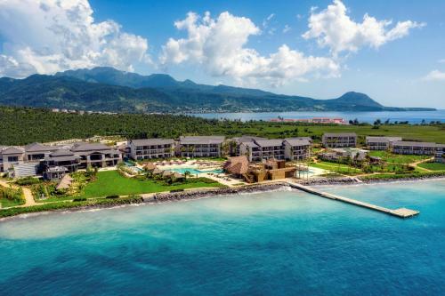 an aerial view of a resort on the beach at InterContinental Dominica Cabrits Resort & Spa, an IHG Hotel in Portsmouth