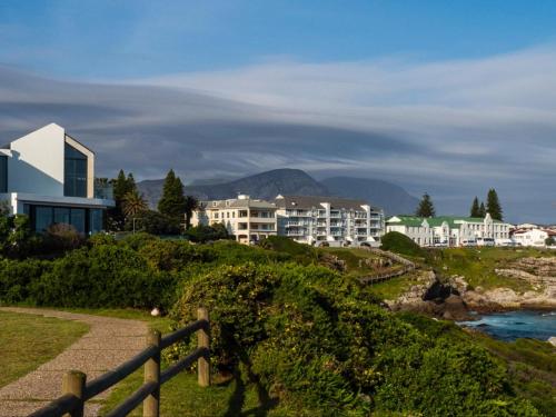 a view of a city with buildings and a river at Boutique Ocean Views - incorporating Wendy's in Hermanus