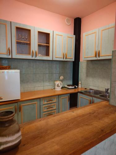 a kitchen with wooden counter tops and cabinets at Agroturystyka UL in Nowe Worowo