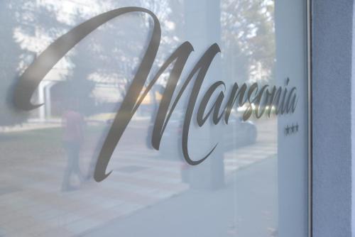 a sign on the window of a store at Room Marsonia in Slavonski Brod