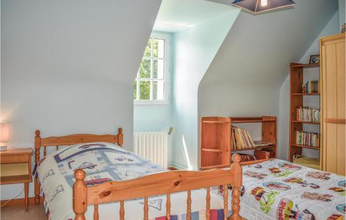 a bedroom with a wooden bed and a book shelf at Cozy Home In Yvias With Indoor Swimming Pool in Yvias