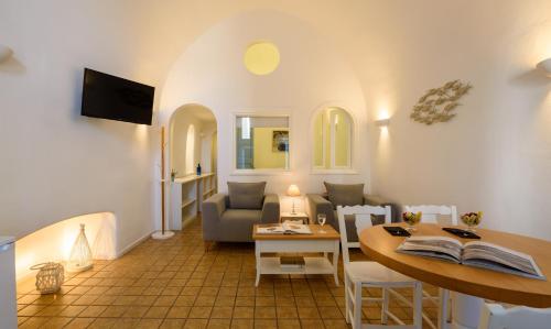 a living room with a couch and a table at Pantelia Suites in Fira