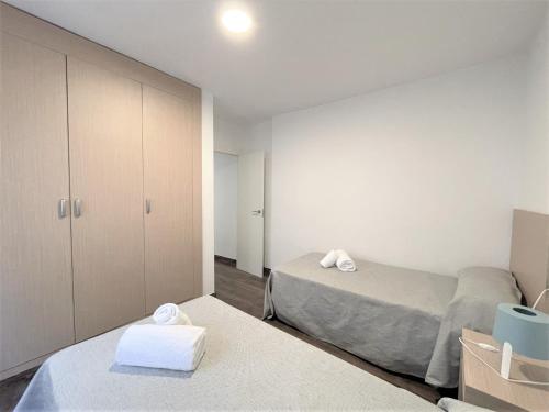 Кровать или кровати в номере L&G Apartamentos Benidorm