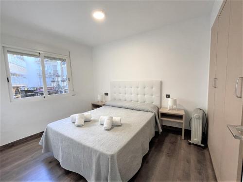Кровать или кровати в номере L&G Apartamentos Benidorm