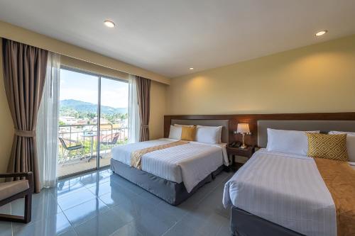 Katil atau katil-katil dalam bilik di Blue Beach Apartment