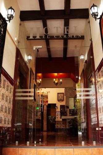 a lobby of a store with a sign that reads librarian at Hotel el Carmen, Morelia in Morelia