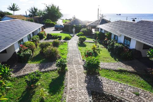 an aerial view of a garden between two houses at Matariki Sunset Apart Hotel in Hanga Roa