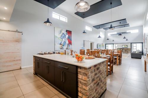 a large kitchen with a large island in the middle at The Greens Guest House in Knysna