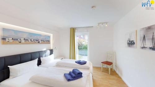 Ένα ή περισσότερα κρεβάτια σε δωμάτιο στο Villa Drees Ferienwohnung 4