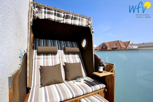 a bed with a canopy on top of a building at Villa Drees Ferienwohnung 12 in Wangerooge