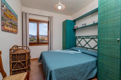Postel nebo postele na pokoji v ubytování Porto San Paolo Apartments