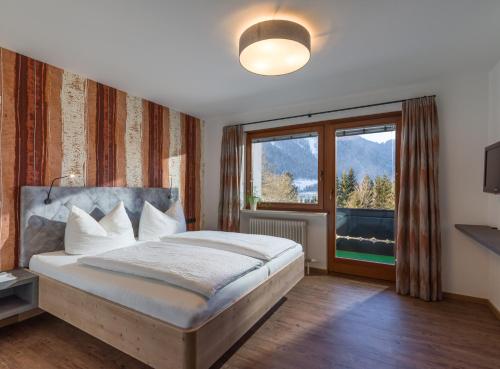 Postel nebo postele na pokoji v ubytování Appartements Rofangarten