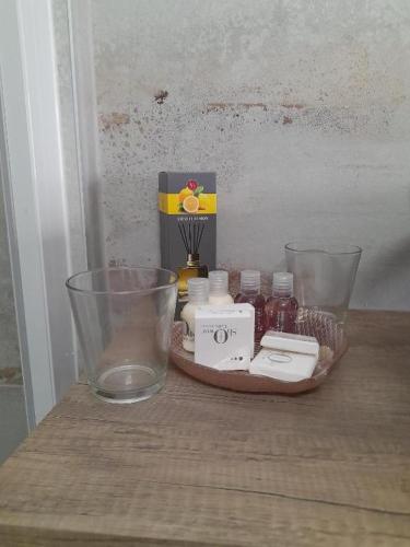 a wooden table with a bowl and some medicines on it at VILLA CARLOTTA GRADO in Grado