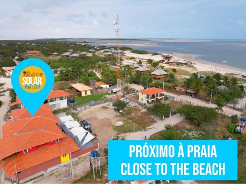 arial view of a resort with the text prompting a puntaanza close to at Pousada Solar Maia Costa in Atins