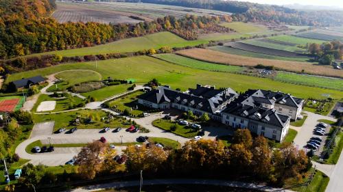 an aerial view of a large house with a park at Dosłońce Resort Wellness & Farm in Racławice