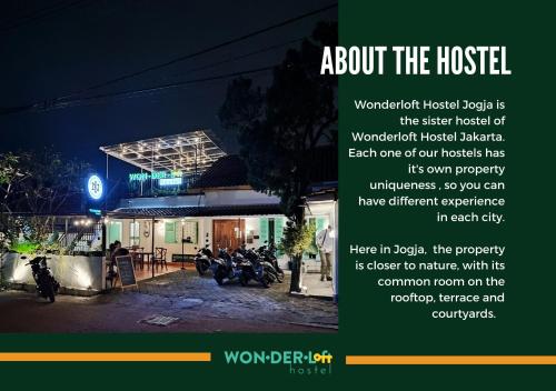un anuncio para un hotel por la noche con motocicletas estacionadas fuera en Wonderloft Hostel Jogja, en Yogyakarta