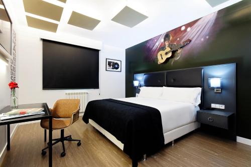 Postel nebo postele na pokoji v ubytování Grupotel Mayorazgo
