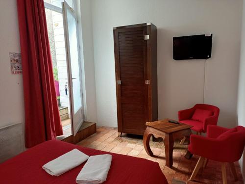 Ένα ή περισσότερα κρεβάτια σε δωμάτιο στο Hotel Saint Amant