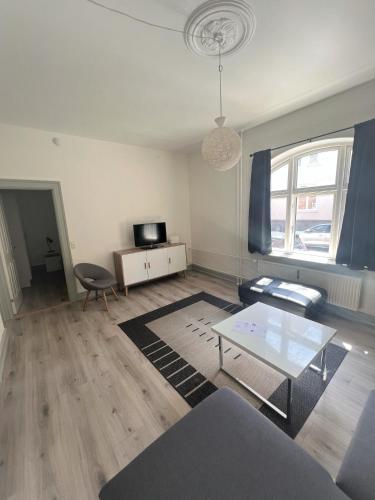 a living room with a couch and a table at Finlandsgade 41 st (id.054) in Esbjerg