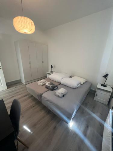 a bedroom with a bed with towels on it at Finlandsgade 41 st (id.054) in Esbjerg