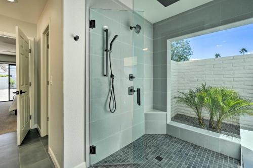 a bathroom with a shower with a glass door at 3 Mi to Kierland! Luxe Desert Home with Heated Pool in Scottsdale